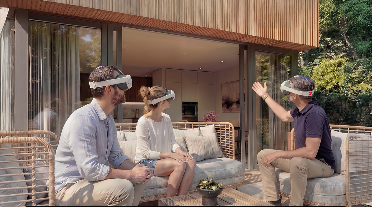 Trois personnes portant des casques de réalité virtuelle, assises dans une situation de terrasse moderne.