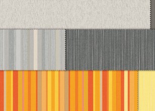 Tissus enroulés, présentant une variété de motifs et de couleurs, principalement vert, bleu et jaune. 