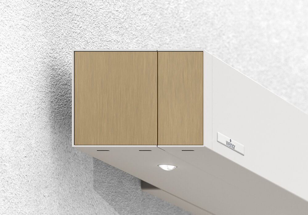 Store de terrasse Smaila avec cassette cubique, couleur de la structure blanc, monté sur une façade moderne