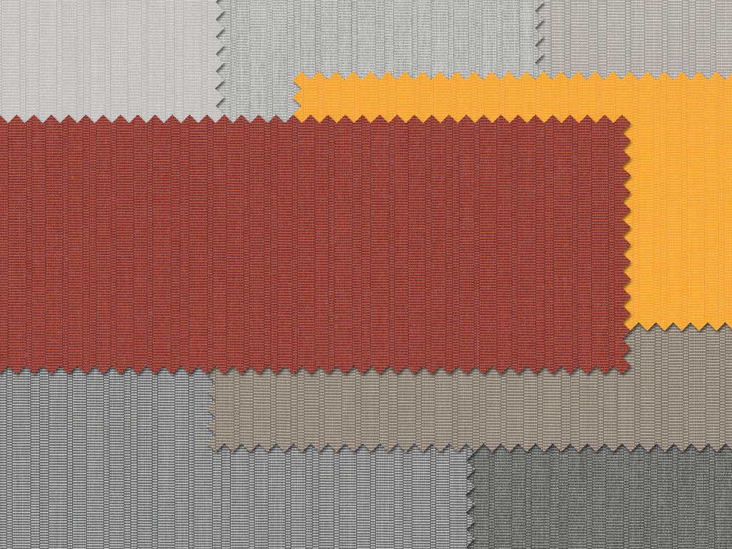 Échantillons de tissus avec des couleurs variées : rouge, orange, gris en textures différentes. Échantillons de tissus avec des couleurs variées : rouge, orange, gris en textures différentes.