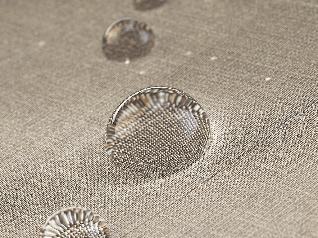 Gouttes d'eau sur une surface texturée de couleur beige. Gouttes d'eau sur une surface texturée de couleur beige.