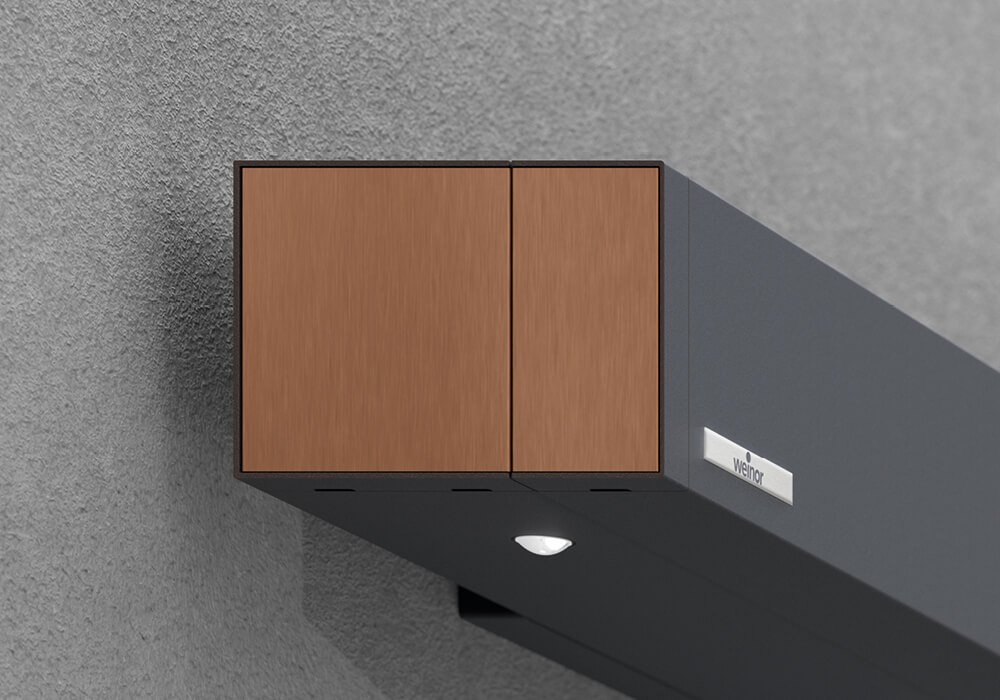 Store de terrasse Smaila avec cassette cubique, couleur de la structure gris anthracite, monté sur une façade moderne