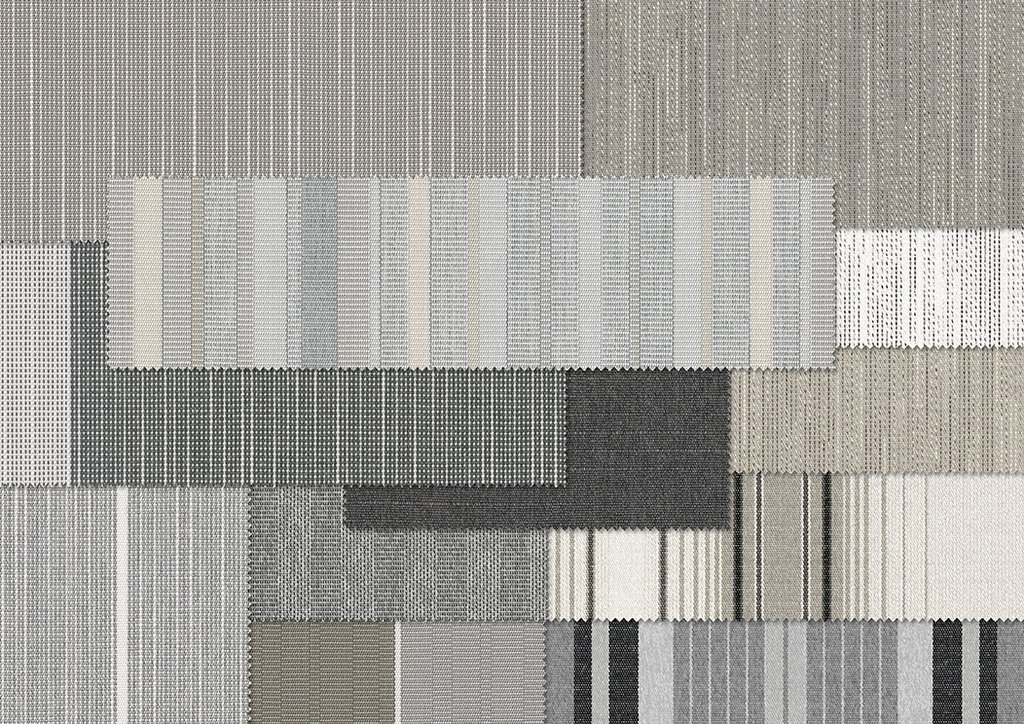 Texte en tissu avec des motifs géométriques dans des nuances de gris et de blanc. Texte en tissu avec des motifs géométriques dans des nuances de gris et de blanc.