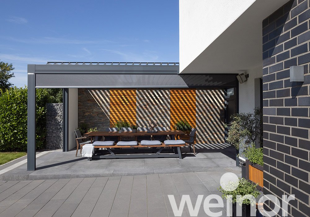 Erkelenz : terrasse protégée contre les intempéries au bord de la piscine  