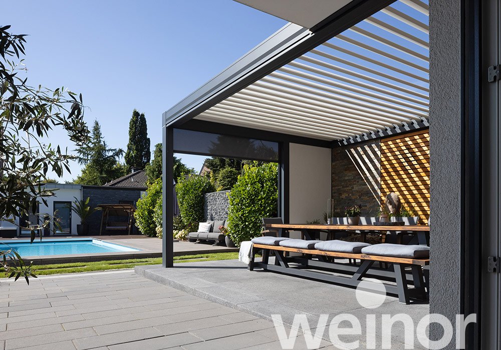 Erkelenz : terrasse protégée contre les intempéries au bord de la piscine  