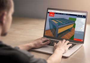 Une personne utilise un ordinateur portable pour visualiser un modèle 3D d'une structure de protection.