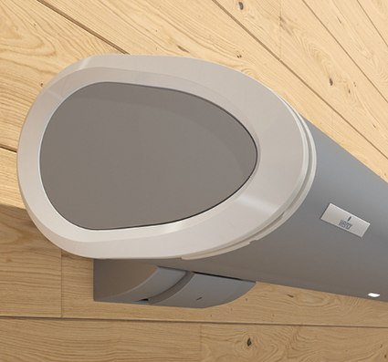 caisson de store en forme arrondie de couleur grise, fixé sur un mur en bois clair.